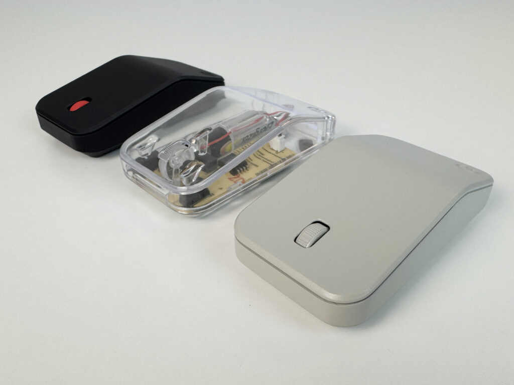 Three versions of the Retromouse: black, clear and grey