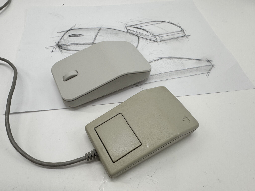 The Retromouse next to the classic original, with the design sketches